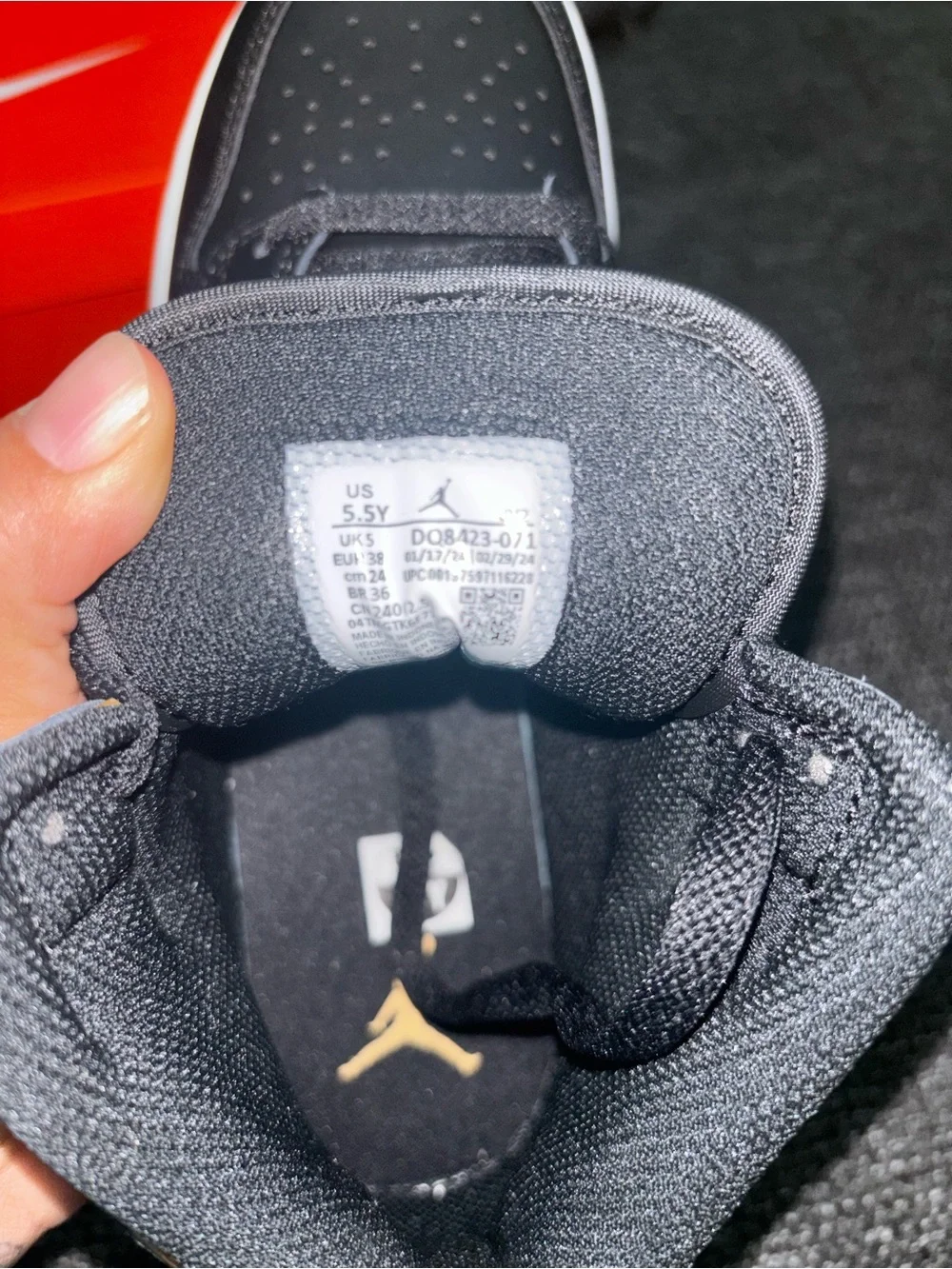 Jordan Black and Gold Mid-Top Sneaker